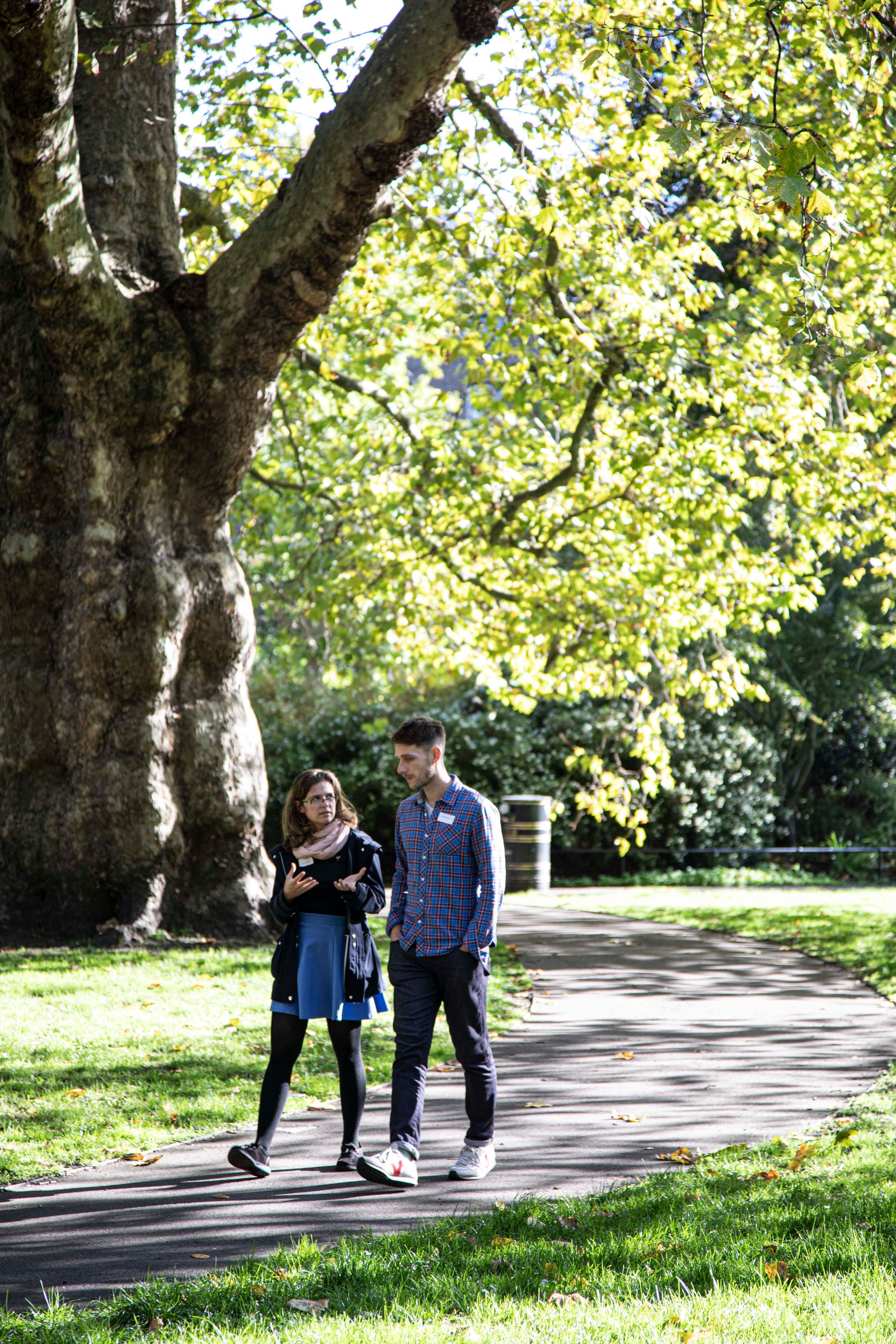Two people walking_NRLP Two poeple walking while talking_NRLP
